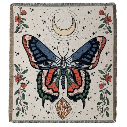 A cream-colored woven floral cotton blanket with a stylized butterfly and boho floral decorbites design navy blue and orange
