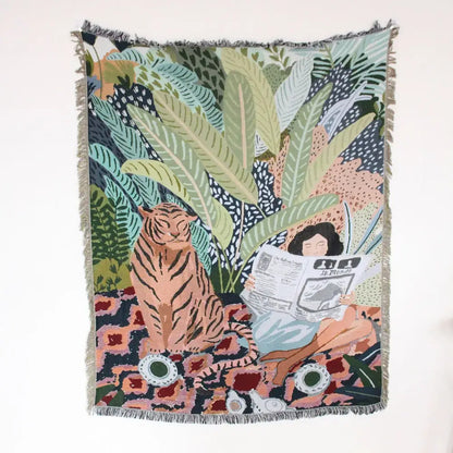 A boho floral cotton blanket with navy blue and orange featuring a woven tapestry of a woman and tiger decorbites boho floral
