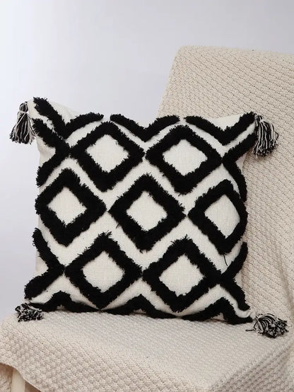Black and white geometric chenille embroidered pillow covers with fringed edges and tassels for boho living room decorbites