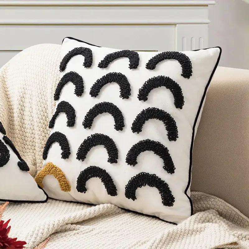 White throw pillow with black textured arc geometric embroidery and a mustard accent arch cushion cover for boho decorbites decor