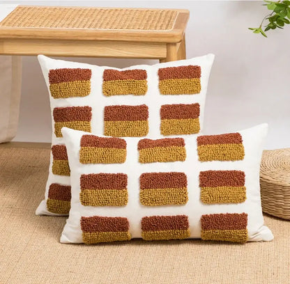 White throw pillows with textured tufted rust and mustard yellow squares boho loop tufte cushion cover decorbites boho loop