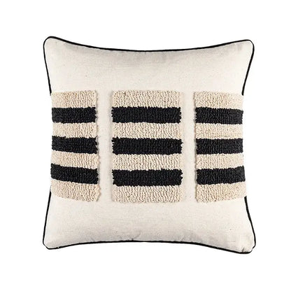 Cream-colored cushion cover with black and cream textured stripes and thin black border decorbites boho geometric tufted design