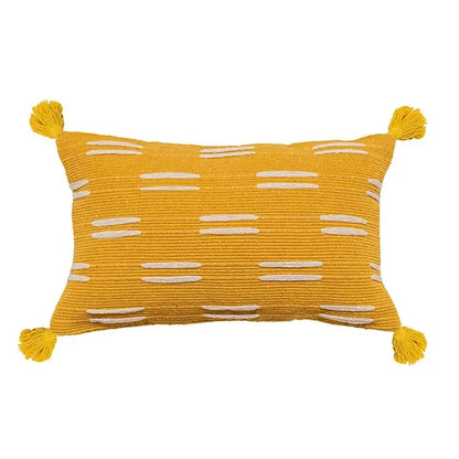 Vibrant yellow cushion cover with white embroidered stripes and tassels by decorbites boho geometric tufted design
