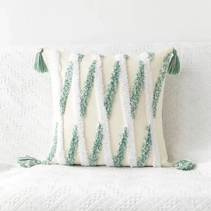 Cream-colored cushion cover with textured green and white vertical stripes and tufted embroidery tassel decorbites geometric tufted design