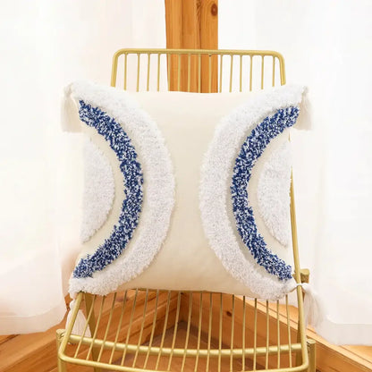 White cushion cover with plush blue and white crescent moon tufted embroidery and tassels for boho decorbites geometric tufted decor