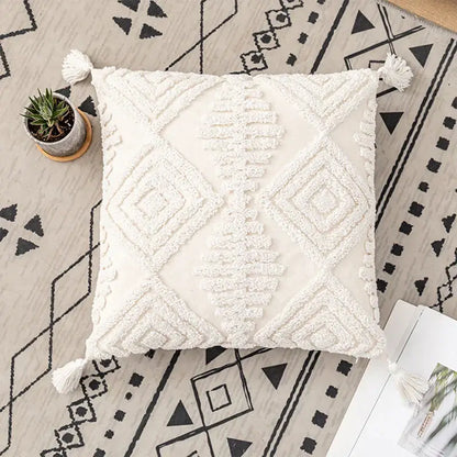 Cream-colored textured cushion cover with geometric embroidery ivory cotton loop decorbites ivory cotton tassels