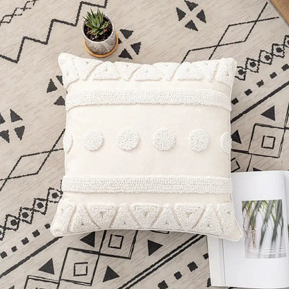 Cream-colored boho ivory cotton loop cushion cover with textured white tufted patterns and geometric designs for decorbites