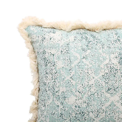 A square pillow cover with light blue and white distressed damask pattern and cream fringe for living room decorbites green tassel
