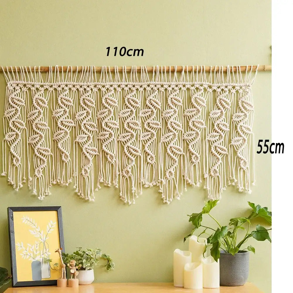 Cream-colored boho macrame tapestry curtain with leaf and swirl patterns on wooden rod for bedroom decorbites decor