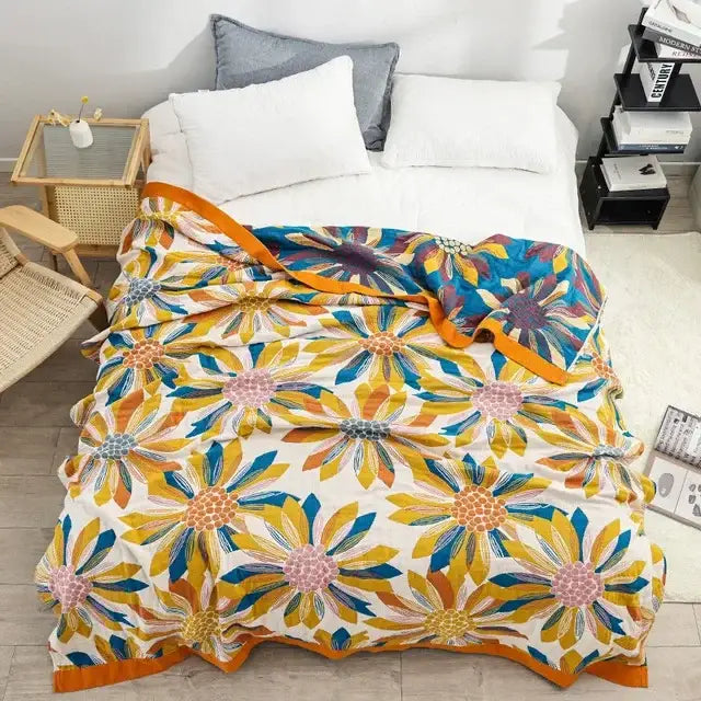 A decorbites boho mandala cotton summer blanket with vibrant floral pattern and orange border for bedroom throw