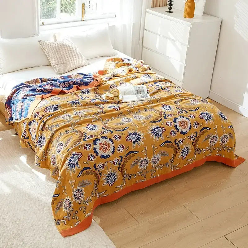 Vibrant mustard-yellow boho mandala cotton summer blanket with intricate navy blue floral patterns for decorbites
