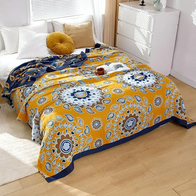 Vibrant yellow boho mandala cotton summer blanket with intricate navy blue white and brown paisley floral patterns