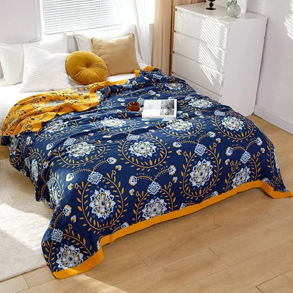 A cozy navy blue and gold floral-patterned boho mandala cotton summer blanket by decorbites for bedroom decor