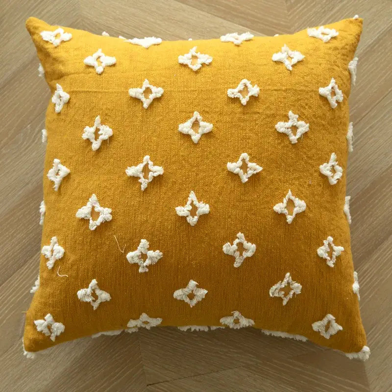 Boho mustard yellow cushion cover with white geometric tufted embroidered diamond patterns and frayed edges for living room decor