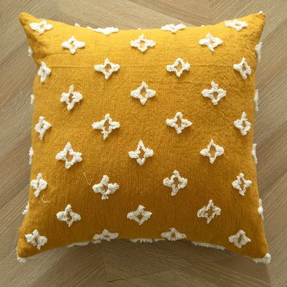 Boho mustard yellow cushion cover with white geometric tufted embroidered diamond patterns and frayed edges for living room decor