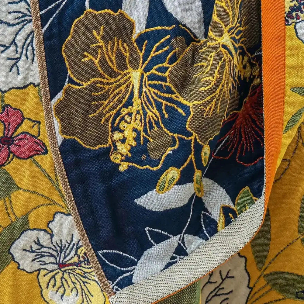 Boho navy and yellow cotton bath towel with gold-embroidered hibiscus flowers and orange trim for bathroom decorbites cotton bath decor