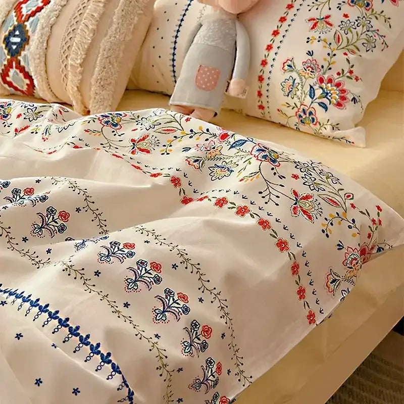 Cream-colored bedding set with decorbites boho pattern printed intricate red blue and green floral embroidery duvet cover