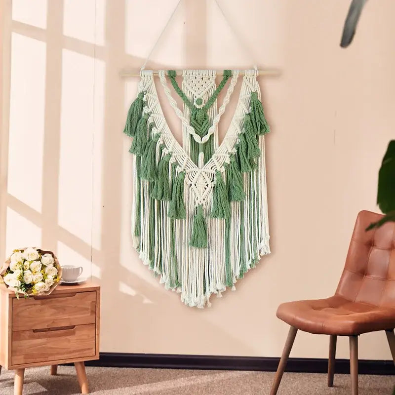 Boho sage green and white wall hanging with intricate macrame tassel stick patterns and matching green macrame tassels