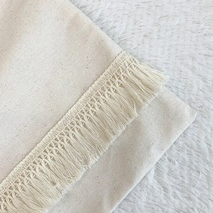 Cream-colored boho style cushion cover with delicate hand-crocheted fringe trim decorbites boho style living room decor