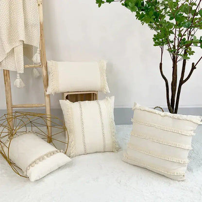 Cream-colored boho style linen cushion cover with fringed edges and decorative stitching for living room decor by decorbites boho style