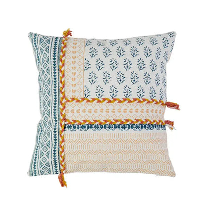Boho style cotton patchwork pillow cover in cream and mustard with blue prints and orange braided trim by decorbites