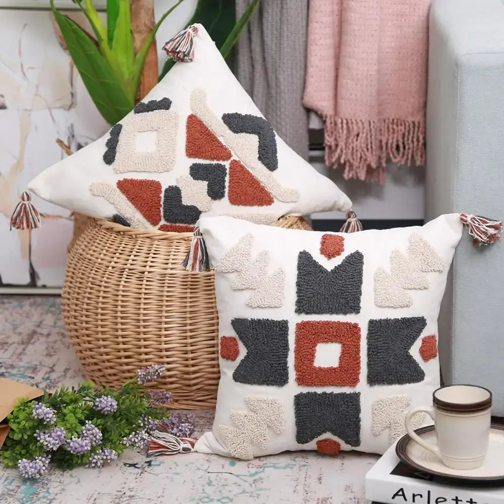 White pillow cover with boho style embroidered geometric patterns in cream and rust decorbites boho style living room decor