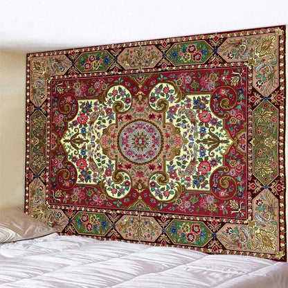 A richly detailed red and gold decorbites boho tapestry set with floral motifs hanging above a bed for bedroom decor