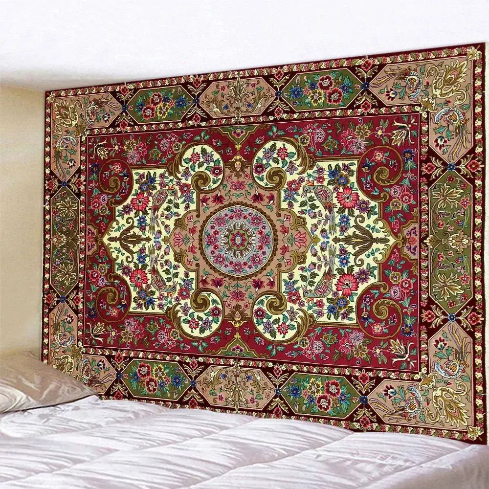 A decorbites boho tapestry set in red and gold featuring intricate floral motifs hanging above a bedroom bed