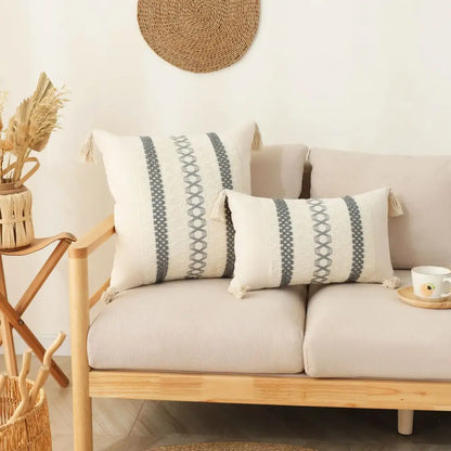Cream-colored boho tassel cushion cover with gray geometric stripes and woven textile for decorbites boho tassel decor