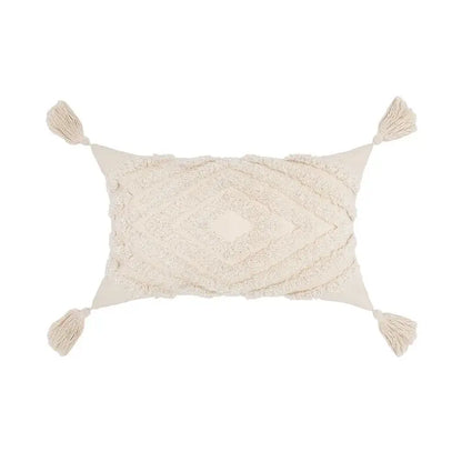 Cream-colored boho tufted beige pillow cover with textured diamond pattern and tassel decor for living room use