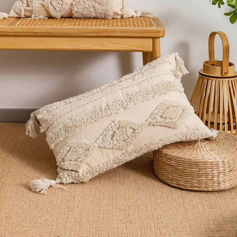 Cream-colored boho tufted embroidered cushion cover with textured fringed tassels and geometric patterns for living room decor