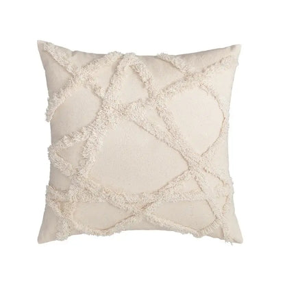 Cream-colored cushion cover with textured frayed geometric pattern in decorbites boho tufted embroidered style