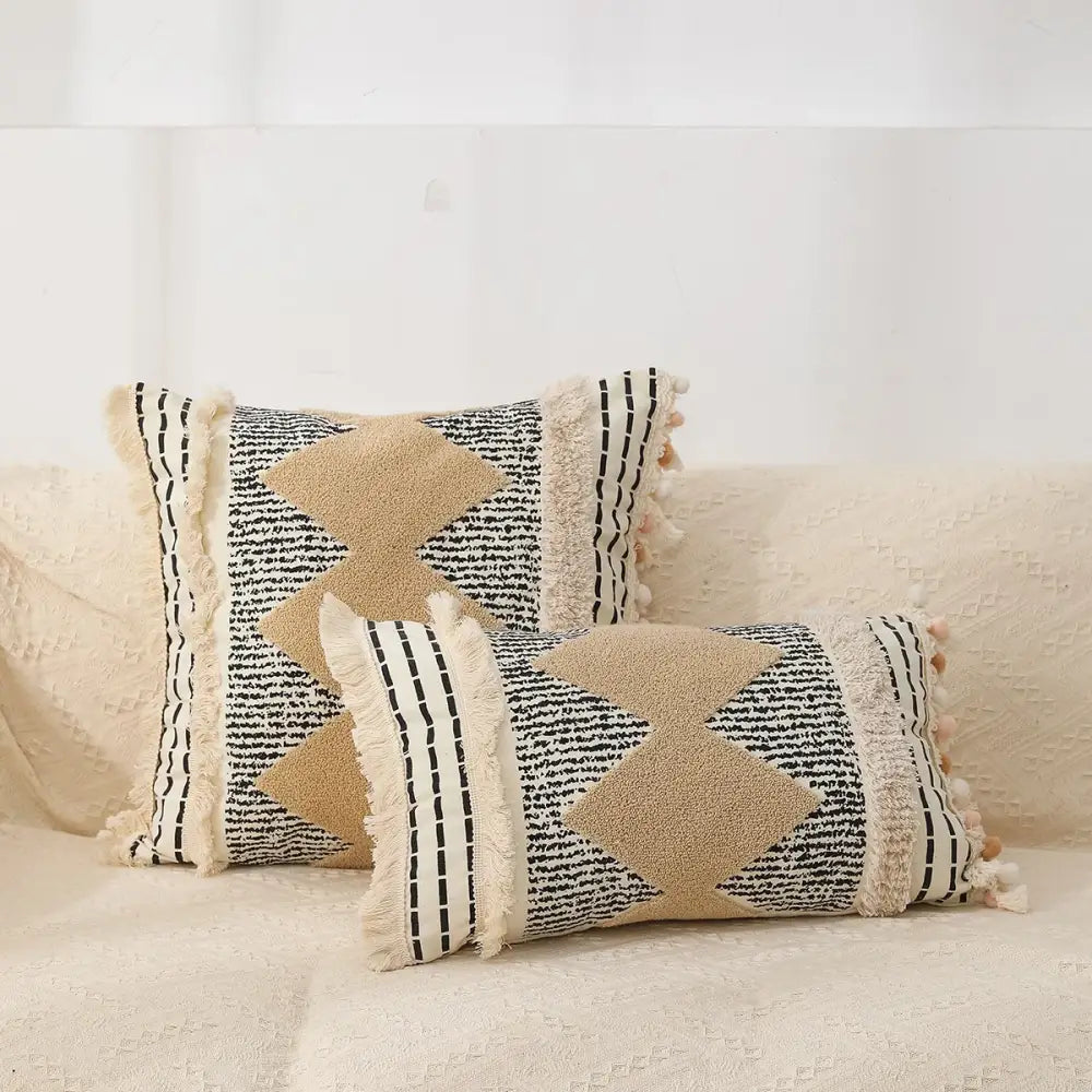 Beige and black woven boho tufted fringed black pillowcases with textured star appliqués for living room decorbites decor