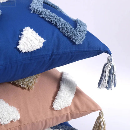 Blue cushion cover with fluffy white and light blue boho tufted tassel decorbites boho tufted tassel design