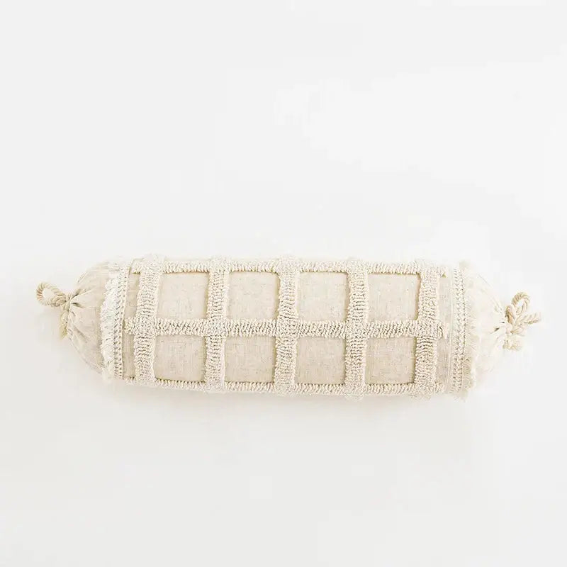 Beige cylindrical cushion cover with textured grid pattern and tied ends for decorbites boho tufted tassel decor