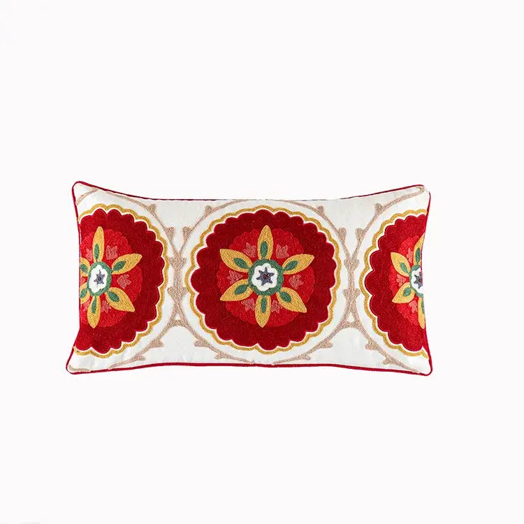 Rectangular boho vintage embroidered alpaca lumbar pillow with vibrant floral medallions and red piping for bedroom decor