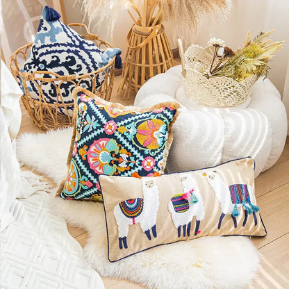 Beige rectangular boho vintage embroidered lumbar pillow featuring colorful alpaca designs and tassels for decorbites boho vintage decor