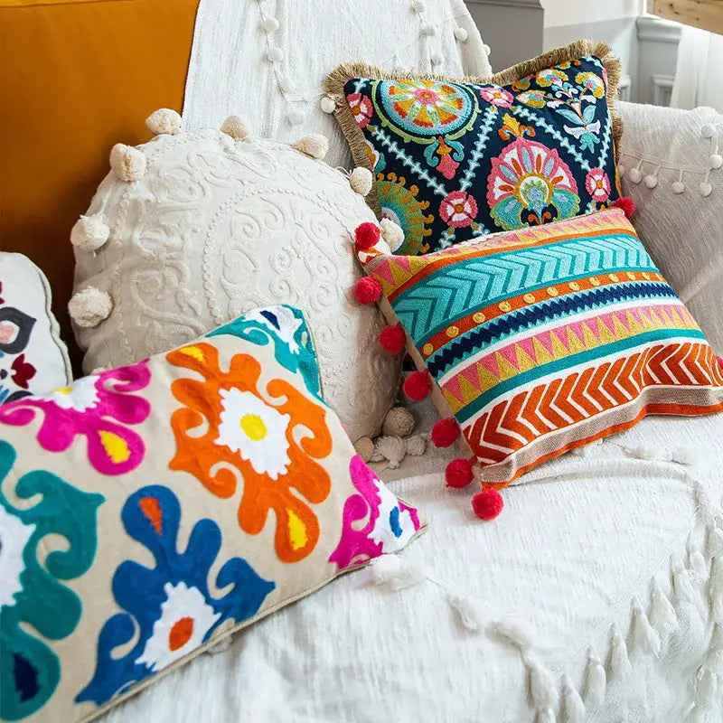 Vibrant boho vintage embroidered alpaca lumbar pillow case with colorful geometric floral patterns and multicolor pom-poms decorbites
