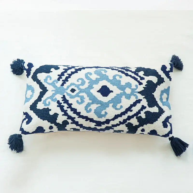 Rectangular boho vintage embroidered alpaca lumbar pillow case with navy and light blue geometric patterns and dark tassels