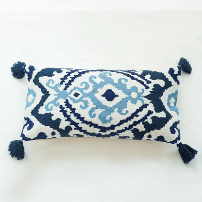 Rectangular boho vintage embroidered alpaca lumbar pillow case with navy and light blue geometric patterns and dark tassels