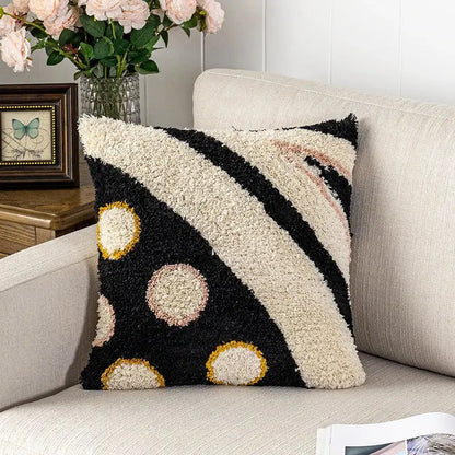Black and cream fluffy tufted pillow cover with bold diagonal stripes and gold outlined circles for decorbites black abstract eye decor