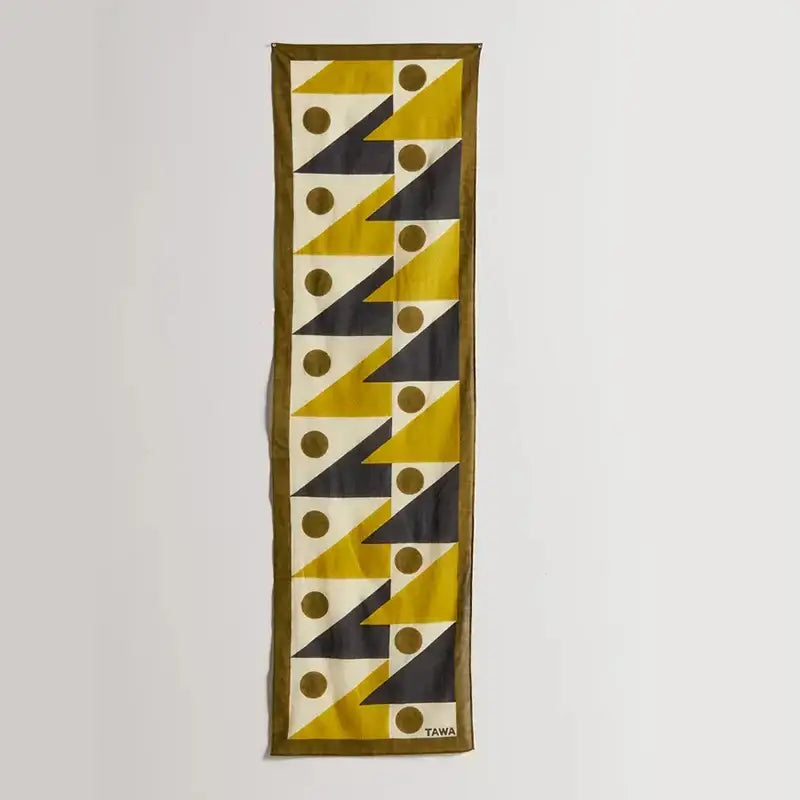 A silk boho yellow and black celestial geometry tapestry scarf with bold triangles and gold circles on off-white background