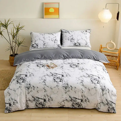 White and black marble-patterned duvet cover set with solid gray inner lining from botanical yellow and white floral cover set