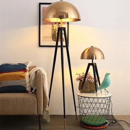 Brass and black decorbites coyote gold tripod floor lamp with brass dome shade and warm glowing light for living room decor