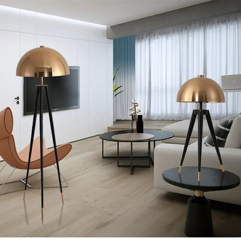 Gold dome floor lamp with black tripod legs and gold accents from decorbites coyote gold tripod for living room decor
