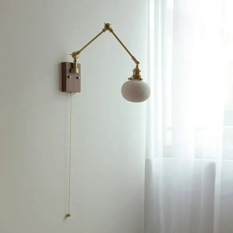 Brass adjustable wall light with ribbed off-white glass globe and wooden backplate decorbites ceramic led wall sconce