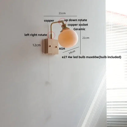 Brass and walnut ceramic led wall light with copper-finished wall sconce and matte ceramic globe shade for bedroom decorbites ceramic led