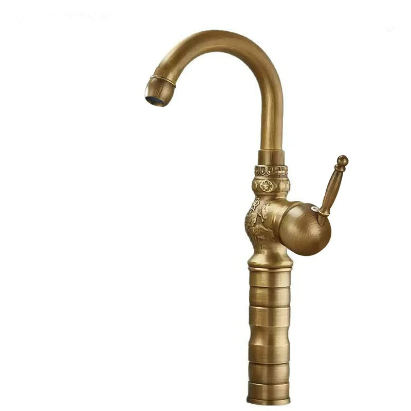 Brass antique bathroom sink faucet with antique brass finish and ornate vintage-inspired curved spout design