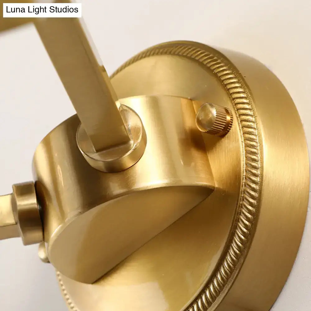 Brass ball sconce wall lamp with ribbed glass shade and brass finish for elegant bedroom lighting