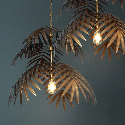 Brass finish boho coconut leaf chandelier with exposed filament bulbs for elegant dining room decorbites boho coconut lighting